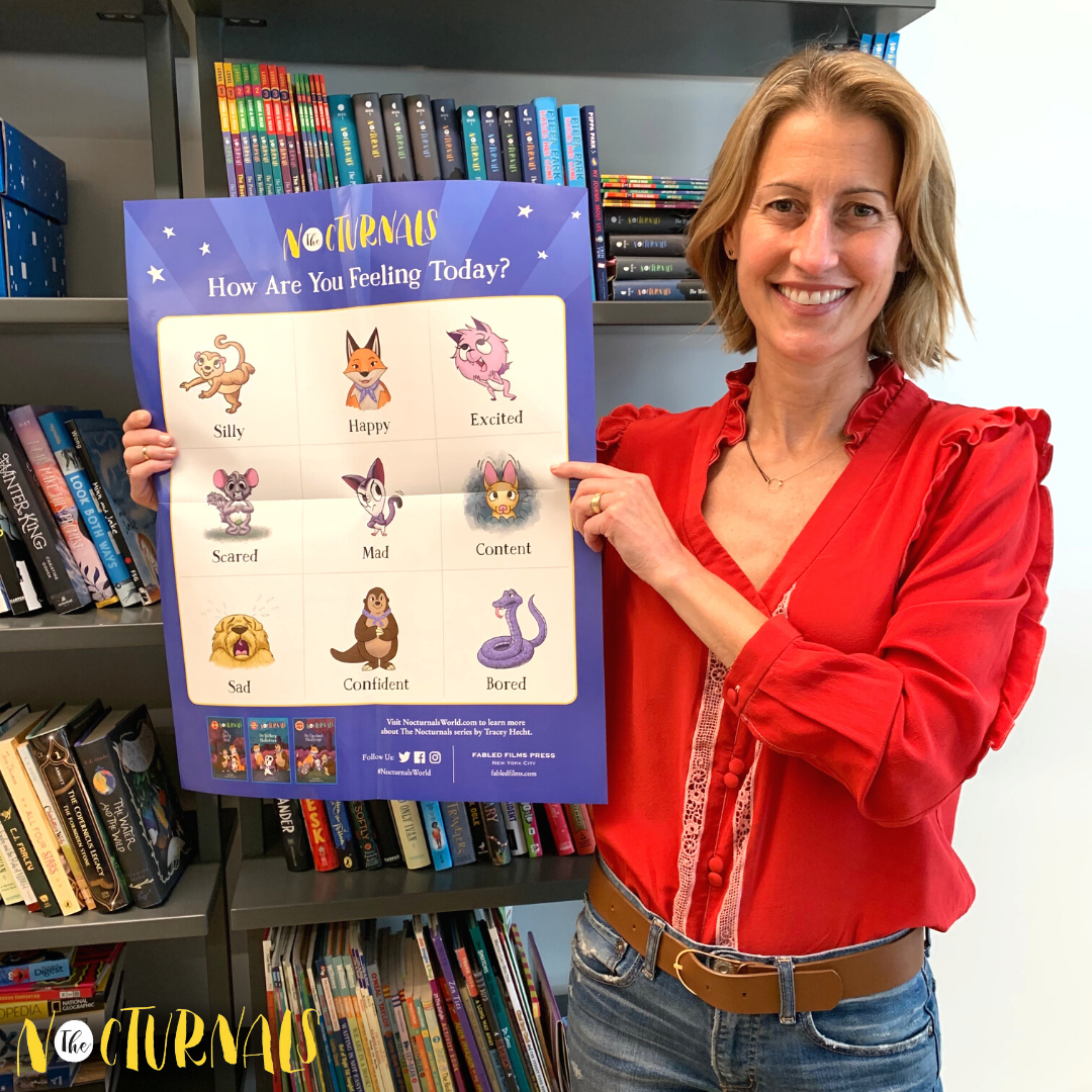 Tracey Hecht, author of The Nocturnals, is holding up the Social Emotional Learning poster where children are asked how theyÃ¢â‚¬â„¢re feeling today and are prompted to point to the appropriate animal character who is displaying the emotion. 