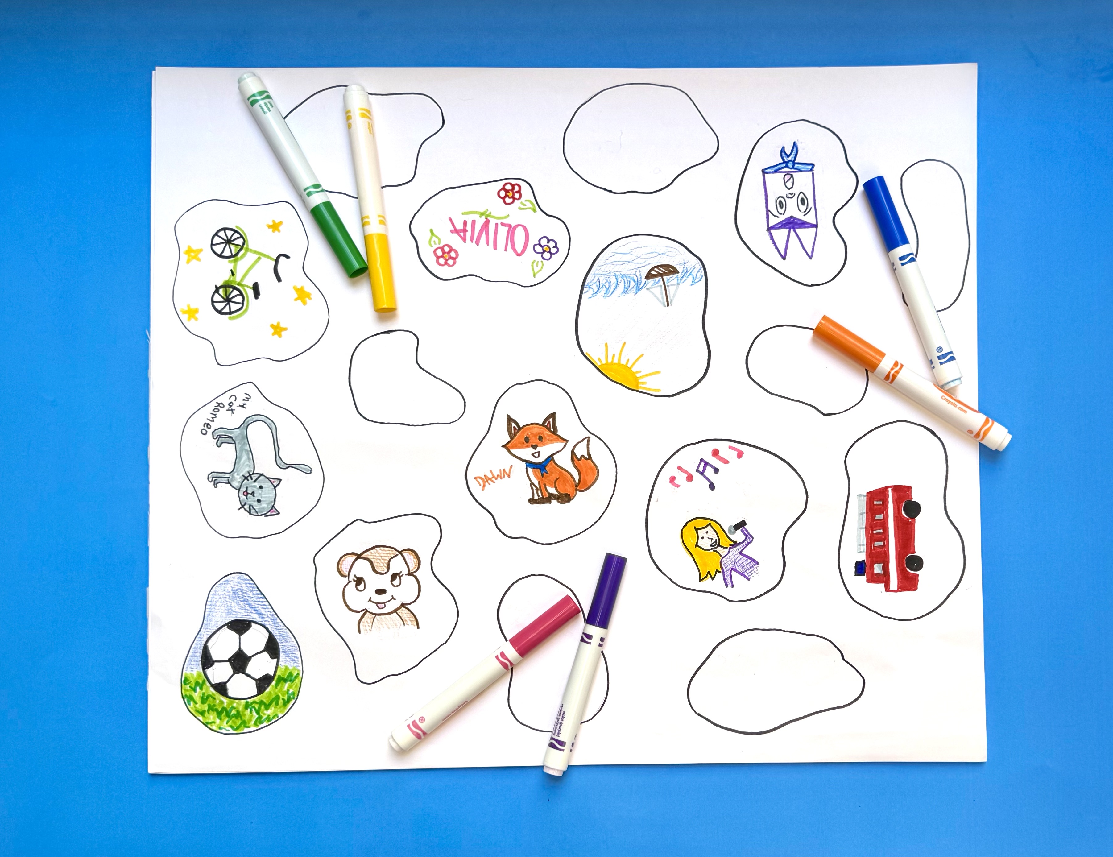 The image shows the paper stones colored in with markers