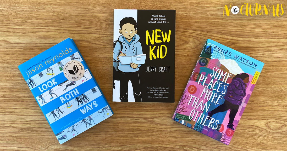 On a wooden desk are three books that are recommended to read for Black History Month. From left to right, the titles are as follows: Look Both Ways by Jason Reynolds, New Kid by Jerry Craft, and Some Places More than Others by RenÃ©e Watson. 